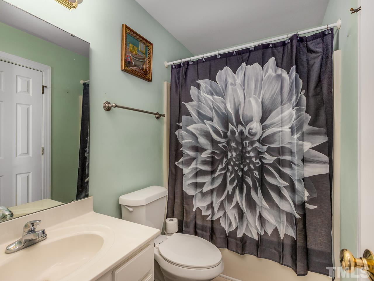 79 Kerrylane Drive Angier, NC 27501 - Photo 30 of 30 a bathroom with a sink toilet and shower