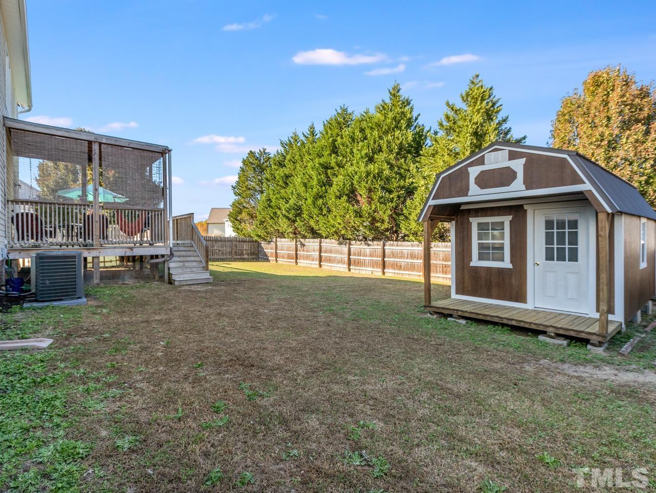 79 Kerrylane Drive Angier, NC 27501 - Photo 5 of 30 a front view of a house with garden