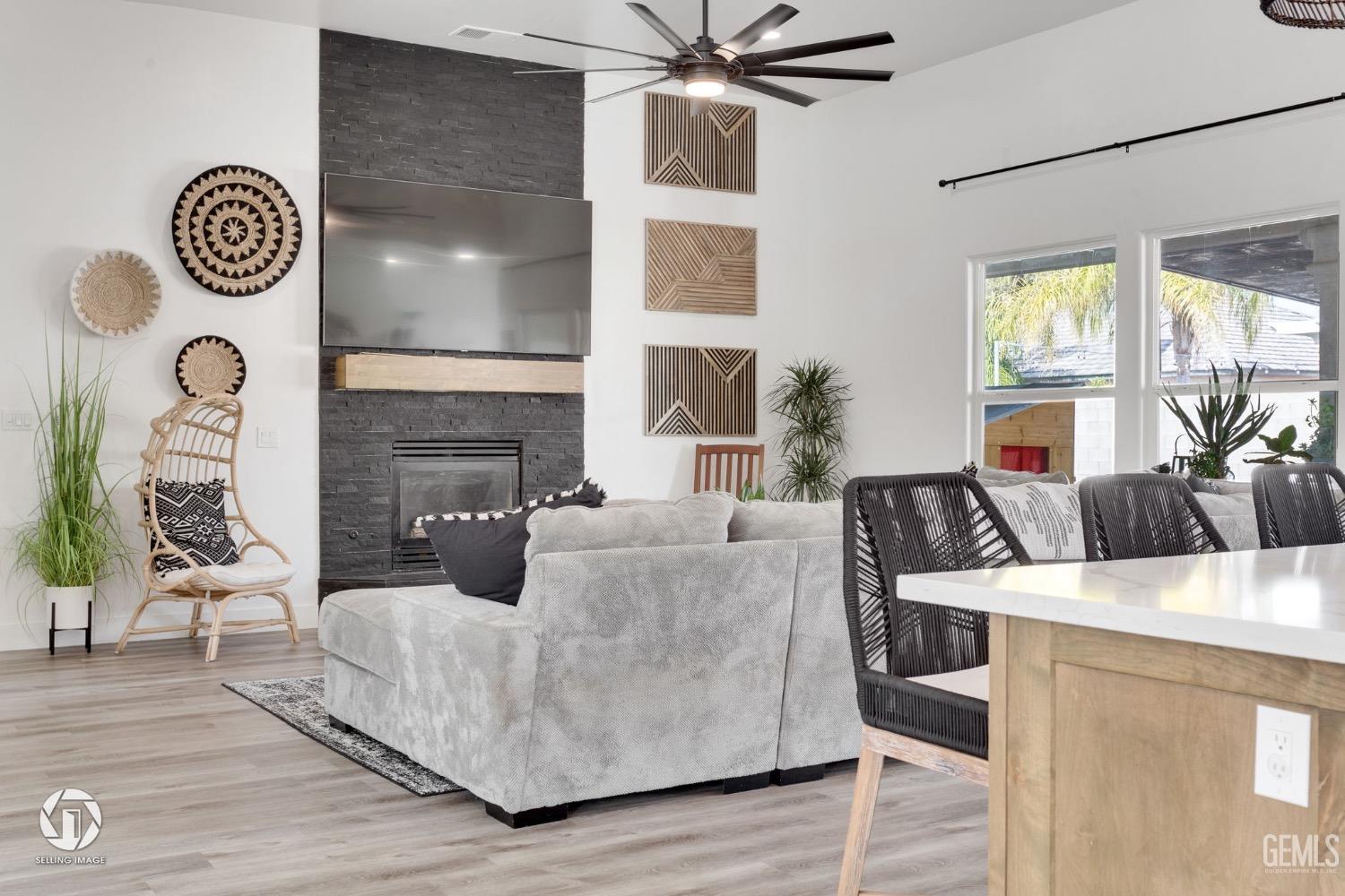 Undisclosed Address Bakersfield, CA 93314 - Photo 11 of 45 a living room with furniture and a fireplace