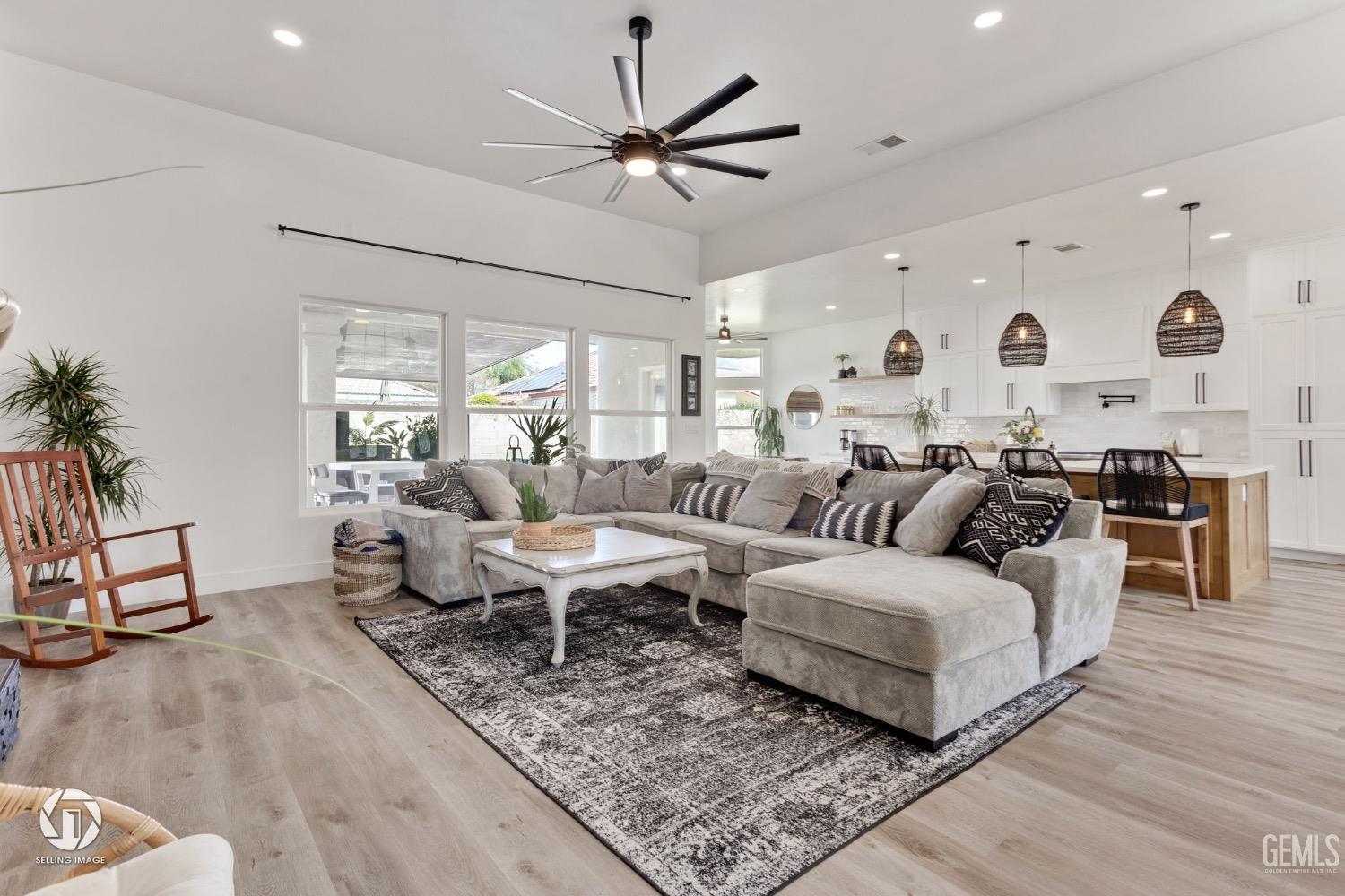 Undisclosed Address Bakersfield, CA 93314 - Photo 15 of 45 a living room with lots of white furniture and a rug