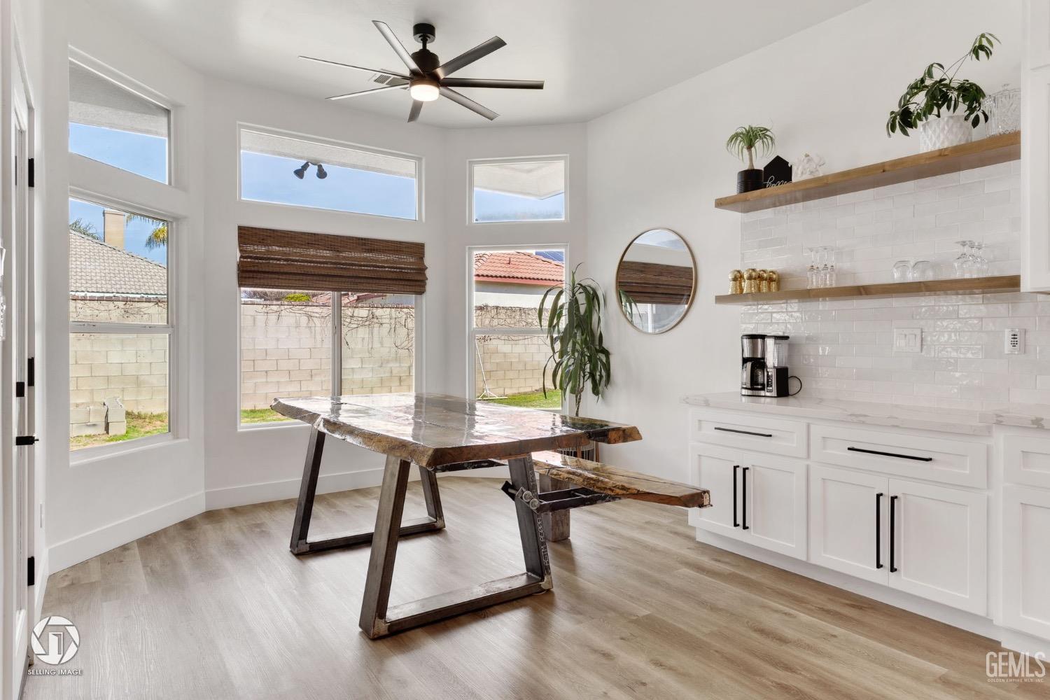 Undisclosed Address Bakersfield, CA 93314 - Photo 19 of 45 a view of a workspace with furniture window and wooden floor