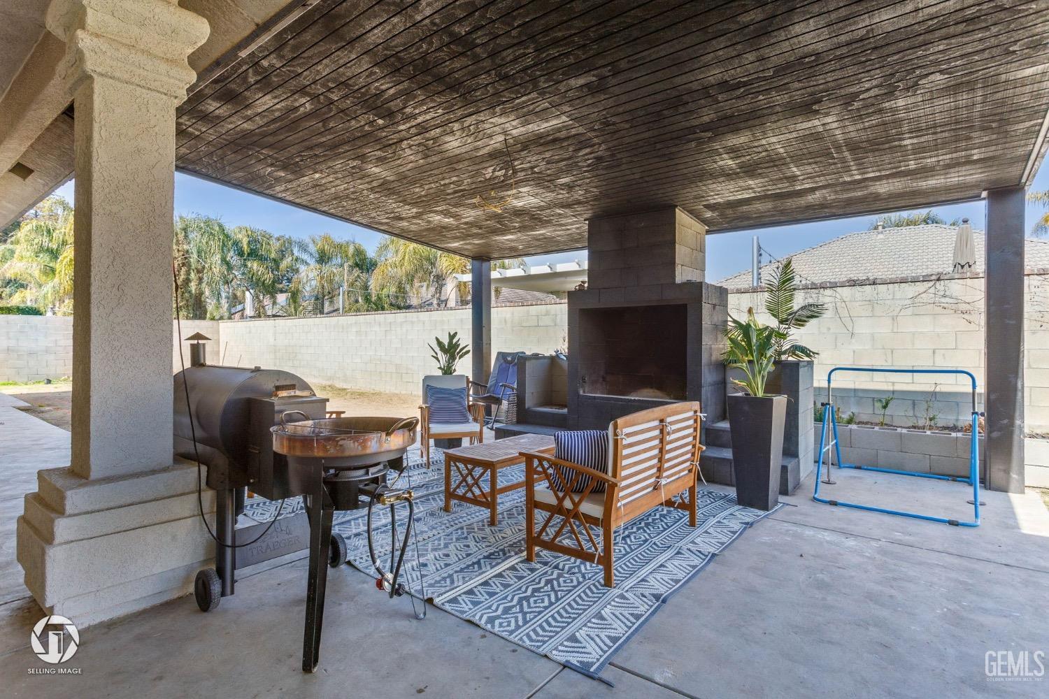 Undisclosed Address Bakersfield, CA 93314 - Photo 42 of 45 a living room with furniture and a floor to ceiling window