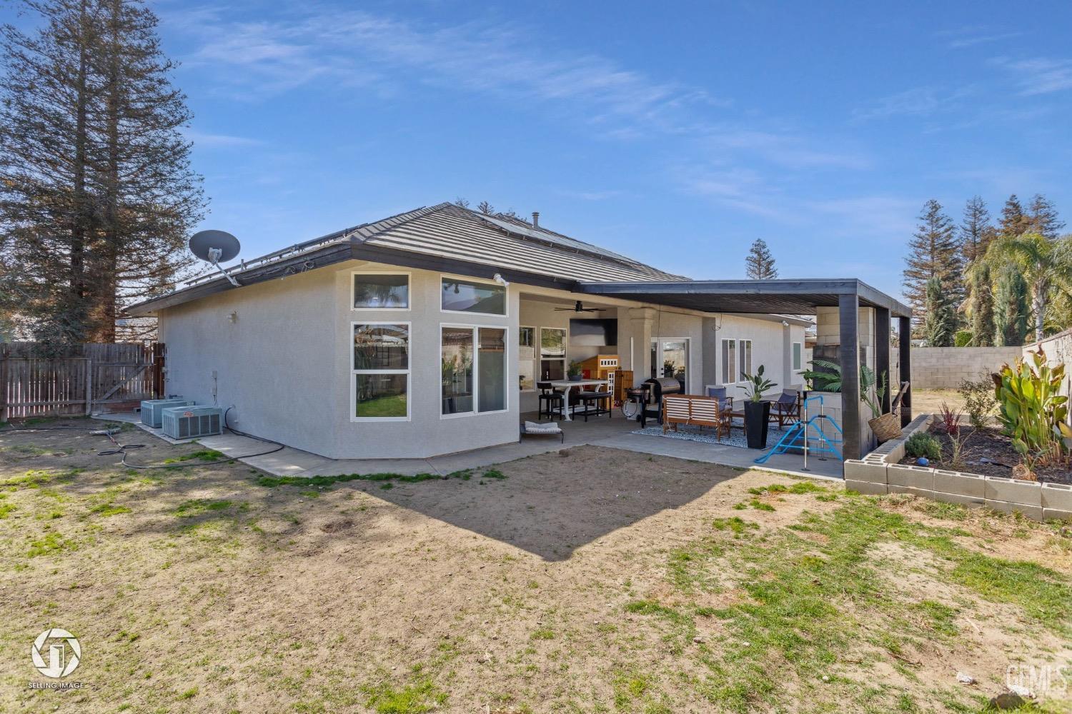Undisclosed Address Bakersfield, CA 93314 - Photo 43 of 45 a view of a house with backyard and sitting area