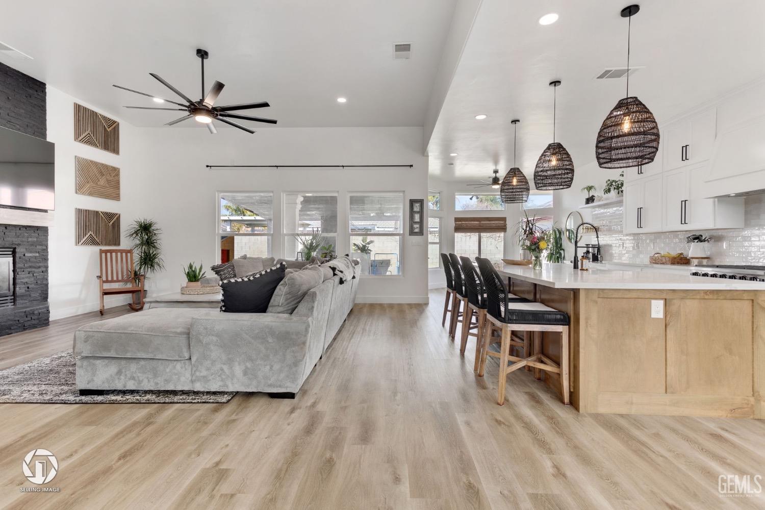 Undisclosed Address Bakersfield, CA 93314 - Photo 6 of 45 a living room with furniture kitchen and a chandelier