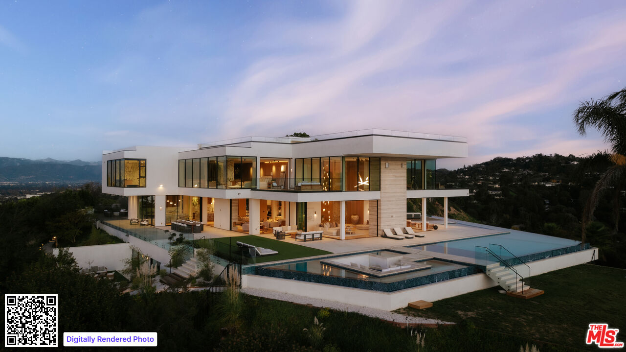 a aerial view of a house with swimming pool garden and patio