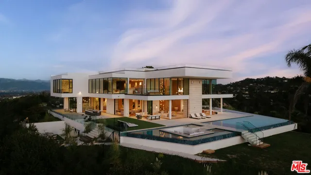 a front view of a house with a yard table and chairs
