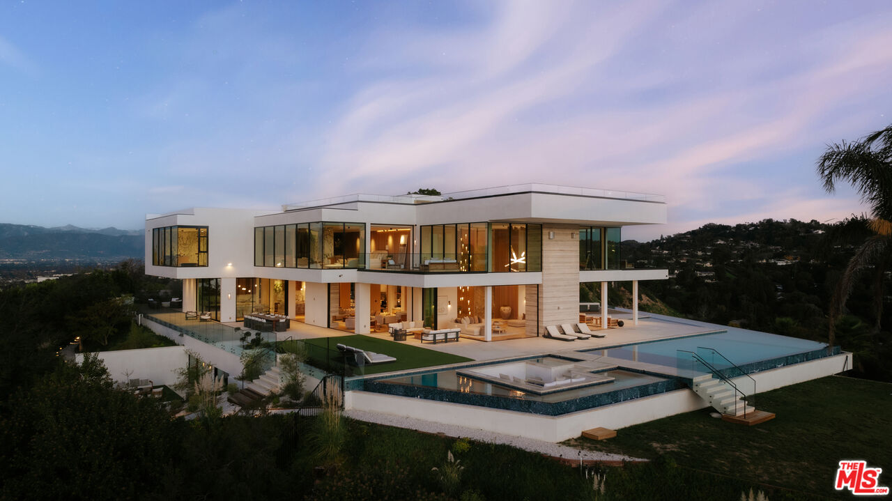a front view of a house with a yard table and chairs