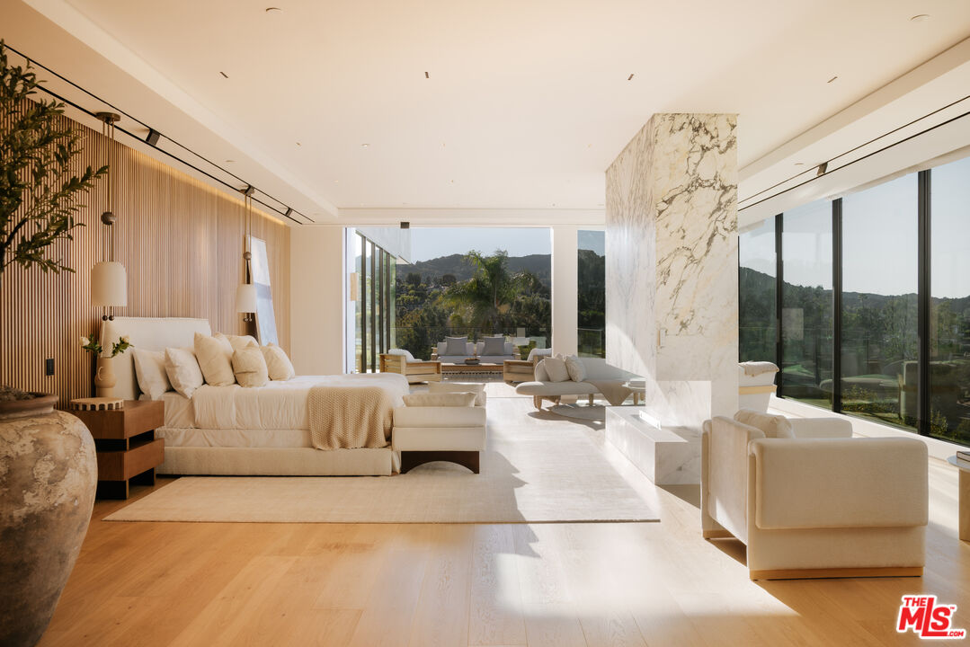 16187 Royal Oak Road Encino, CA 91436 - Photo 12 of 40 a living room with furniture and a large window