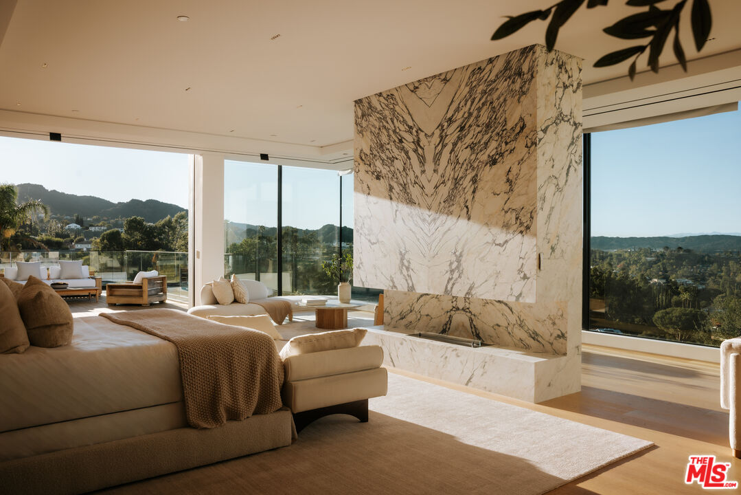 16187 Royal Oak Road Encino, CA 91436 - Photo 13 of 40 a bedroom with a bed couch and window