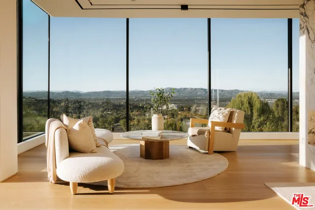 a view of a floor to ceiling window and deck