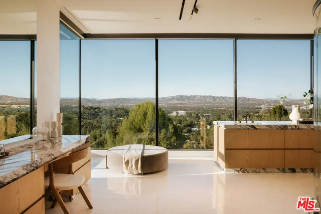a kitchen with a large window and a table
