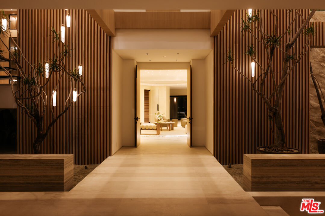 16187 Royal Oak Road Encino, CA 91436 - Photo 22 of 40 a view of a house with a patio