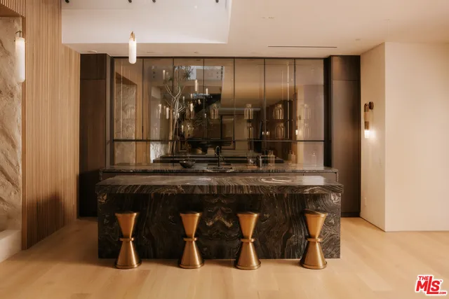 a kitchen with a table and chairs