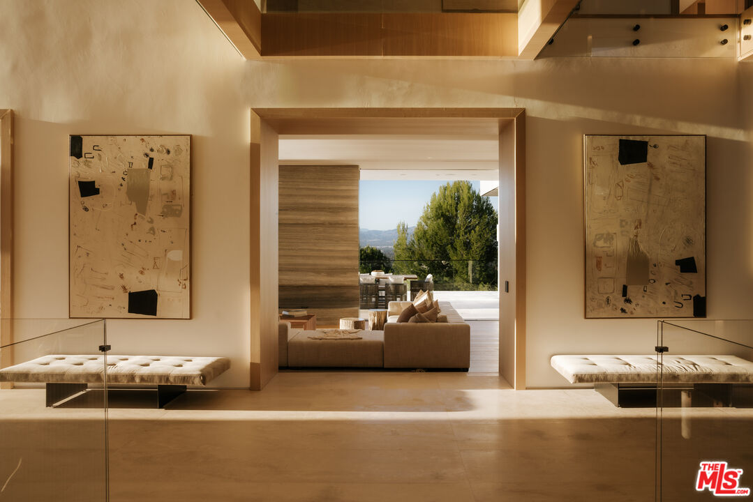 16187 Royal Oak Road Encino, CA 91436 - Photo 33 of 40 a living room with furniture and a large window