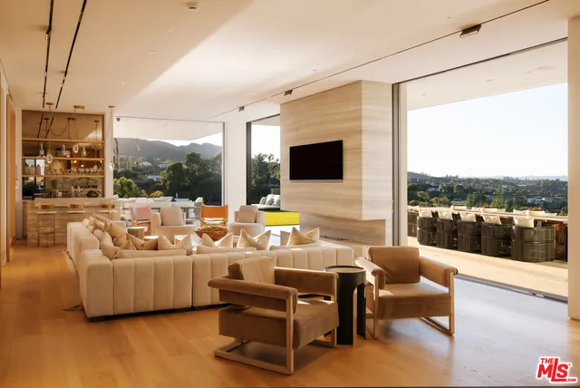 a outdoor space with patio the couches and a flat screen tv