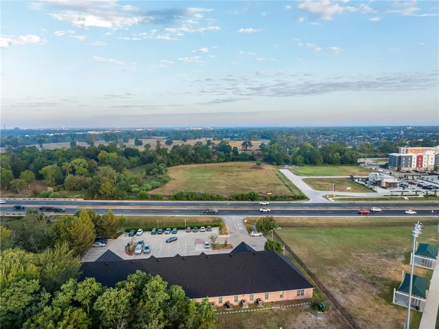 a view of swimming pool with outdoor seating and plants