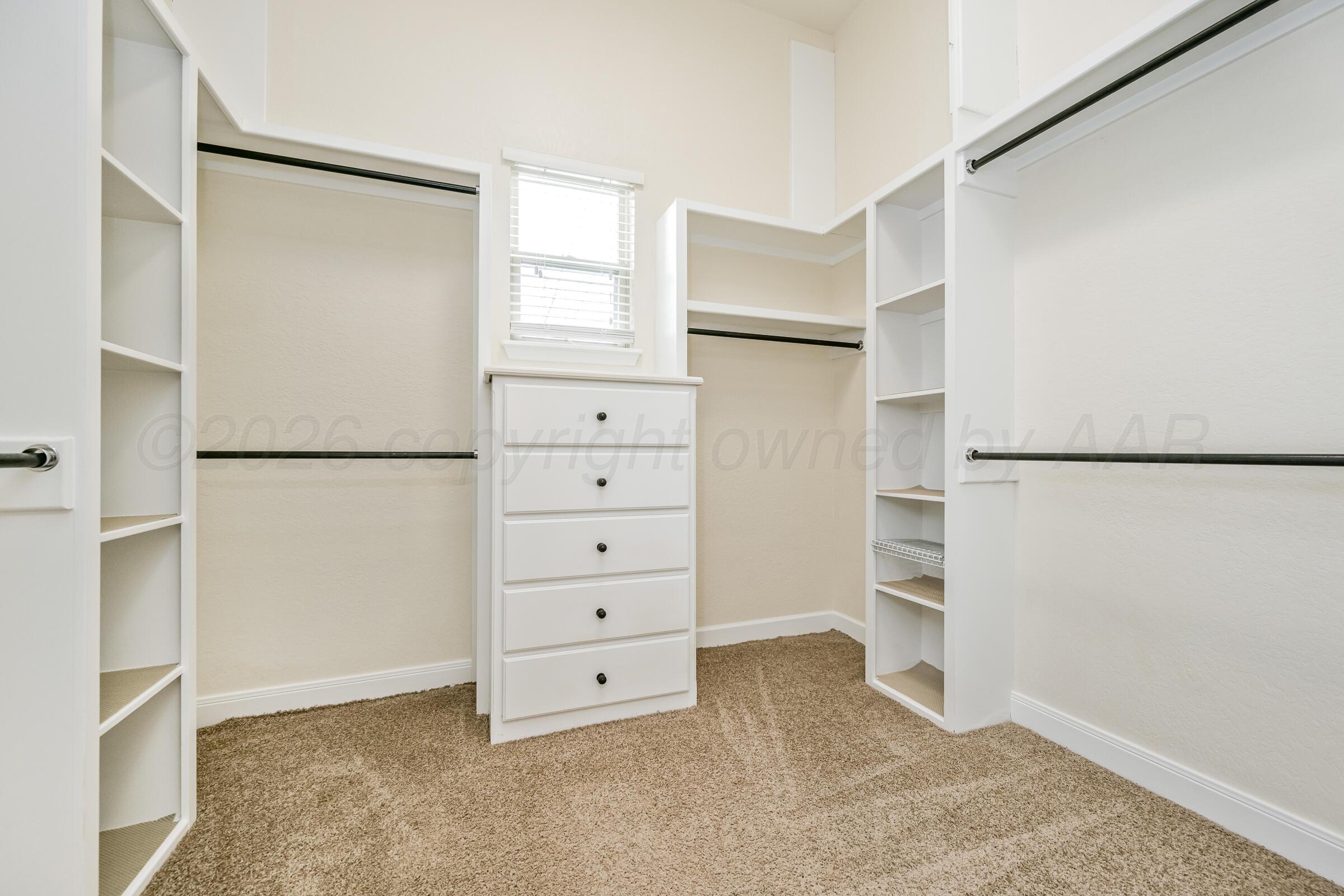 4400 West Farmers Avenue Amarillo, TX 79110 - Photo 18 of 27 a view of walk in closet with cabinet