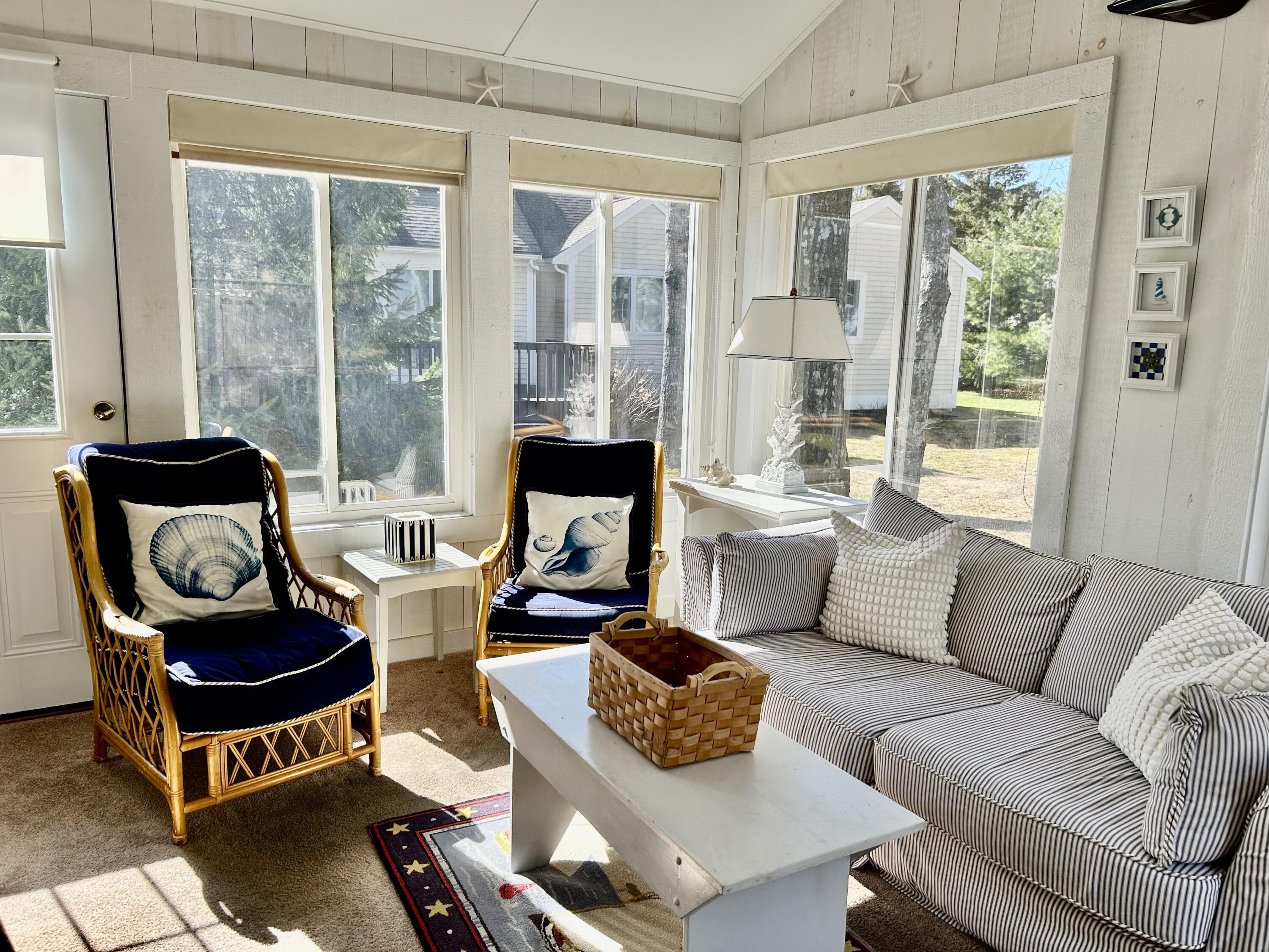 28 Windward Street, Unit 28 Mashpee, MA 02649 - Photo 16 of 37 a living room with furniture and a large window
