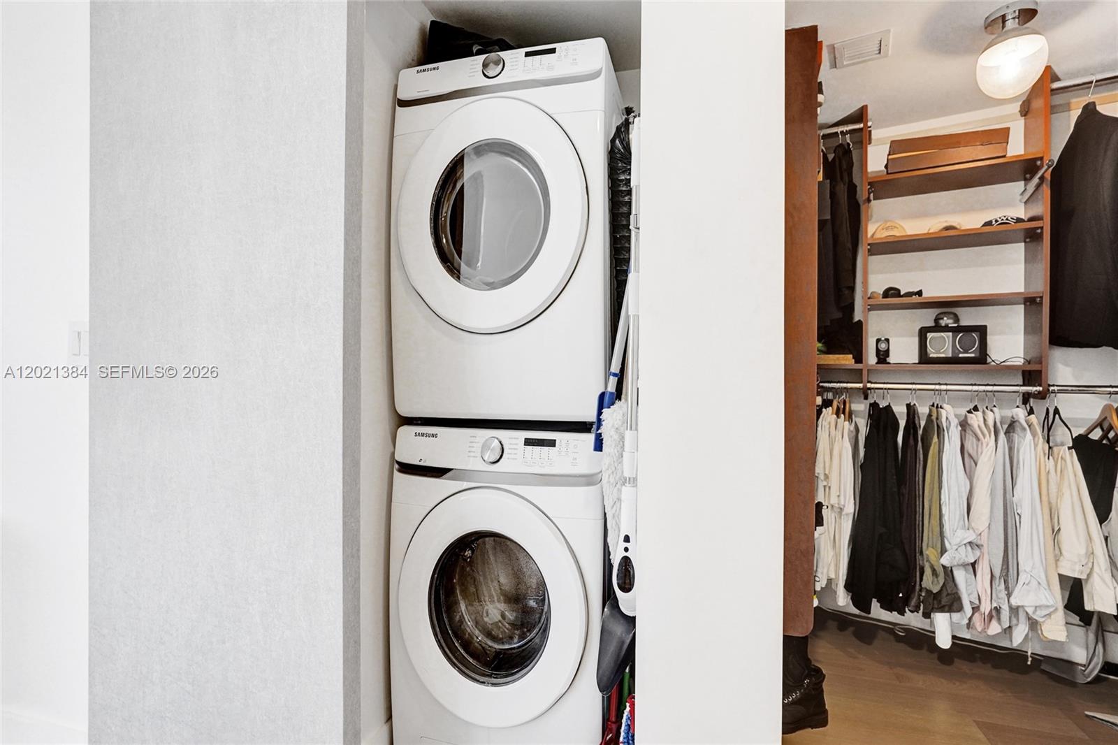 400 Alton Road, Unit PH11 Miami Beach, FL 33139 - Photo 33 of 49 a utility room with dryer and washer