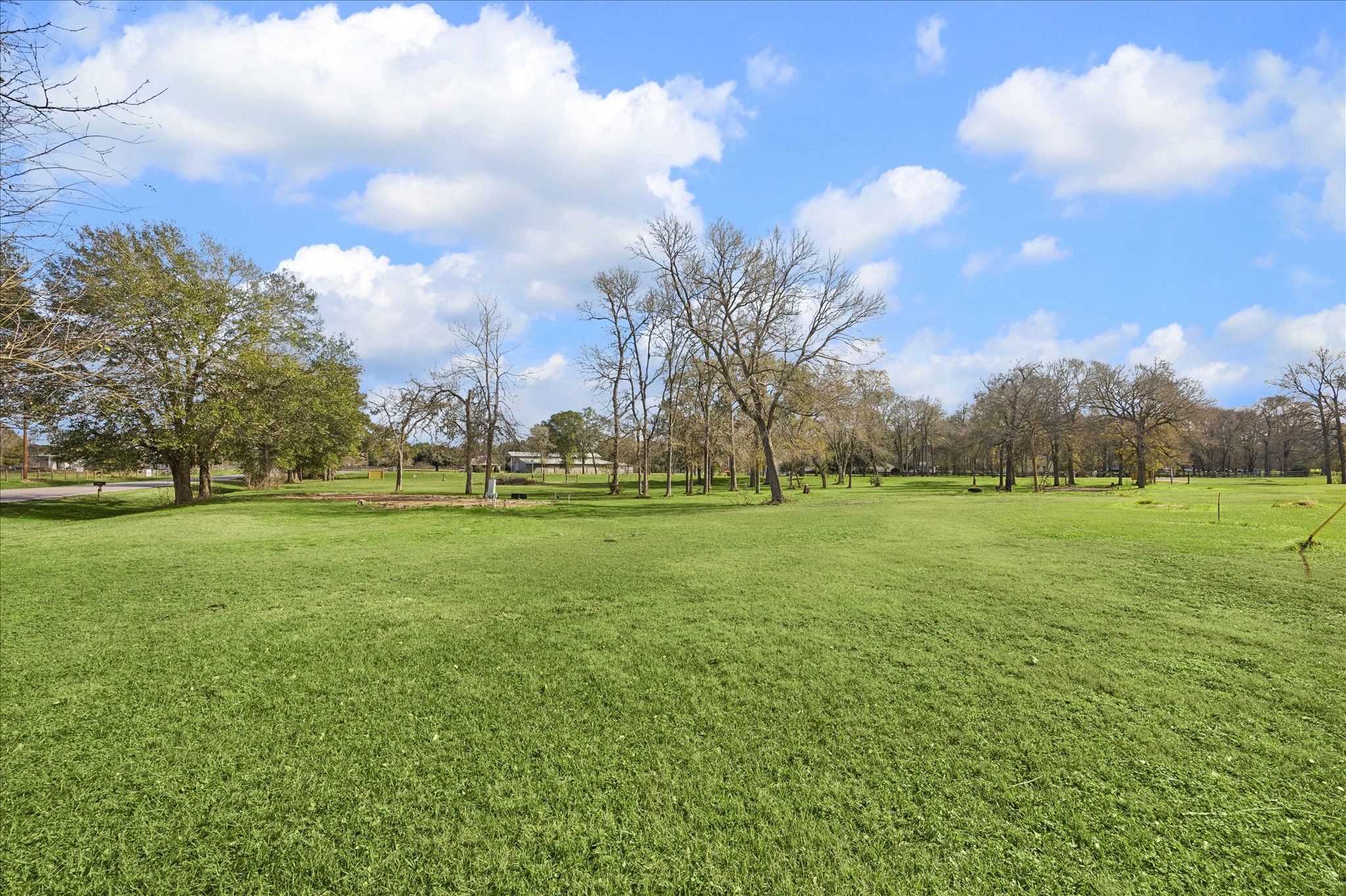 4343 Buller Road Brookshire, TX 77423 - Photo 12 of 13 a view of a field of grass and trees