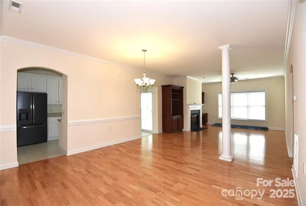 a view of a hall with wooden floor