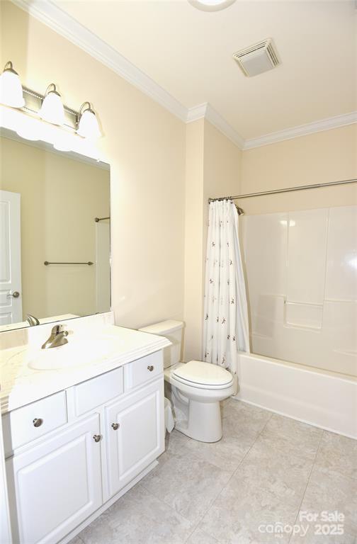 415 Garner Drive Salisbury, NC 28146 - Photo 8 of 19 a bathroom with a double vanity sink a toilet a mirror and shower