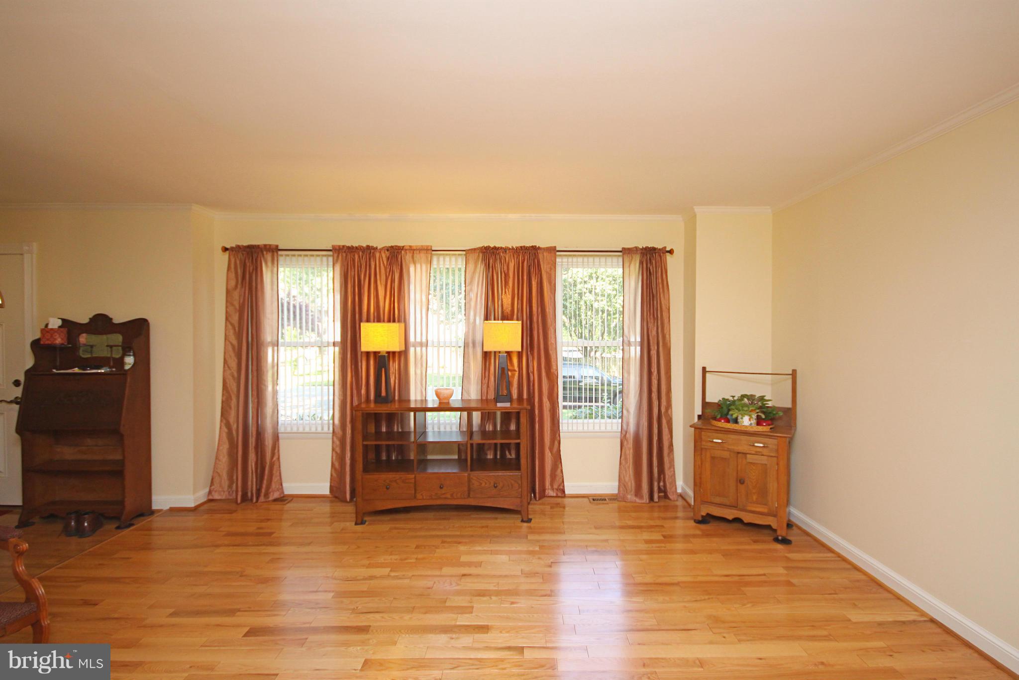 7707 Mahogany Road Severn, MD 21144 - Photo 5 of 30 a view of an empty room with glass door and a window