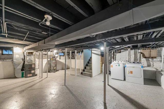 a view of a yard with a house and a large tree