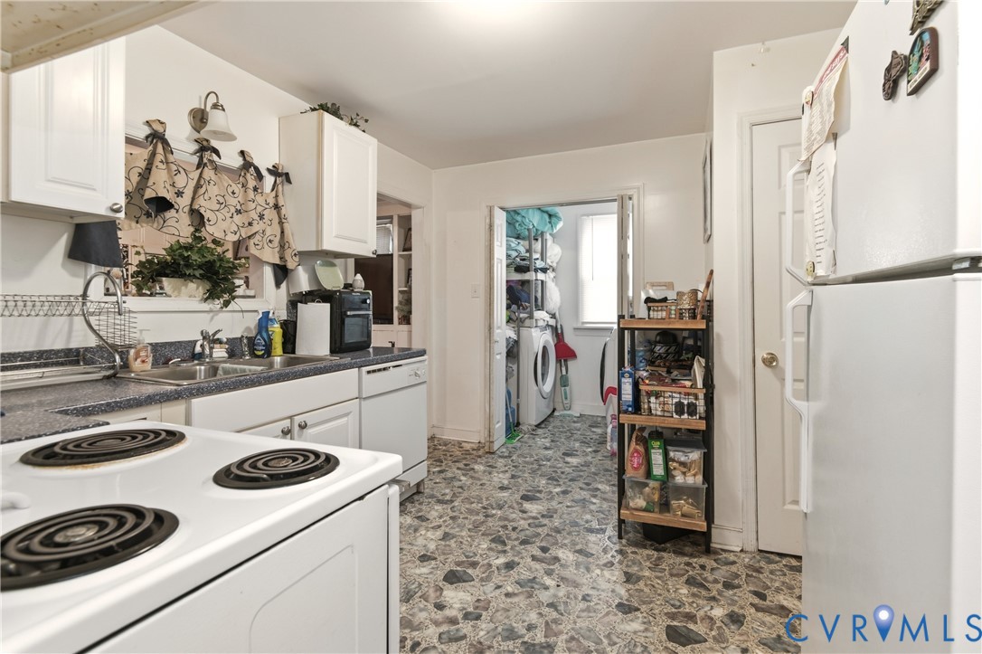 1311 Williamsburg Road Richmond, VA 23231 - Photo 16 of 38 Kitchen featuring white cabinetry, a double basin