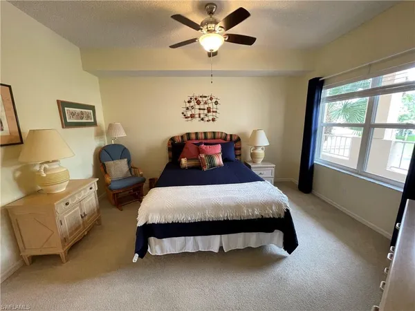 a bedroom with bed and window