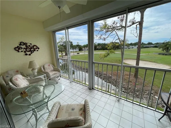 a living room with large windows