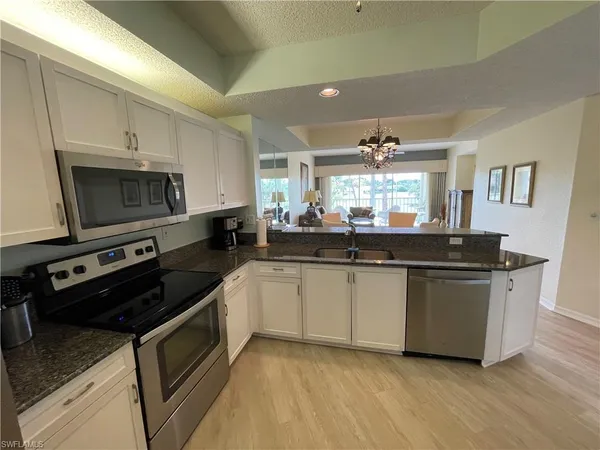a kitchen with a stove and a microwave
