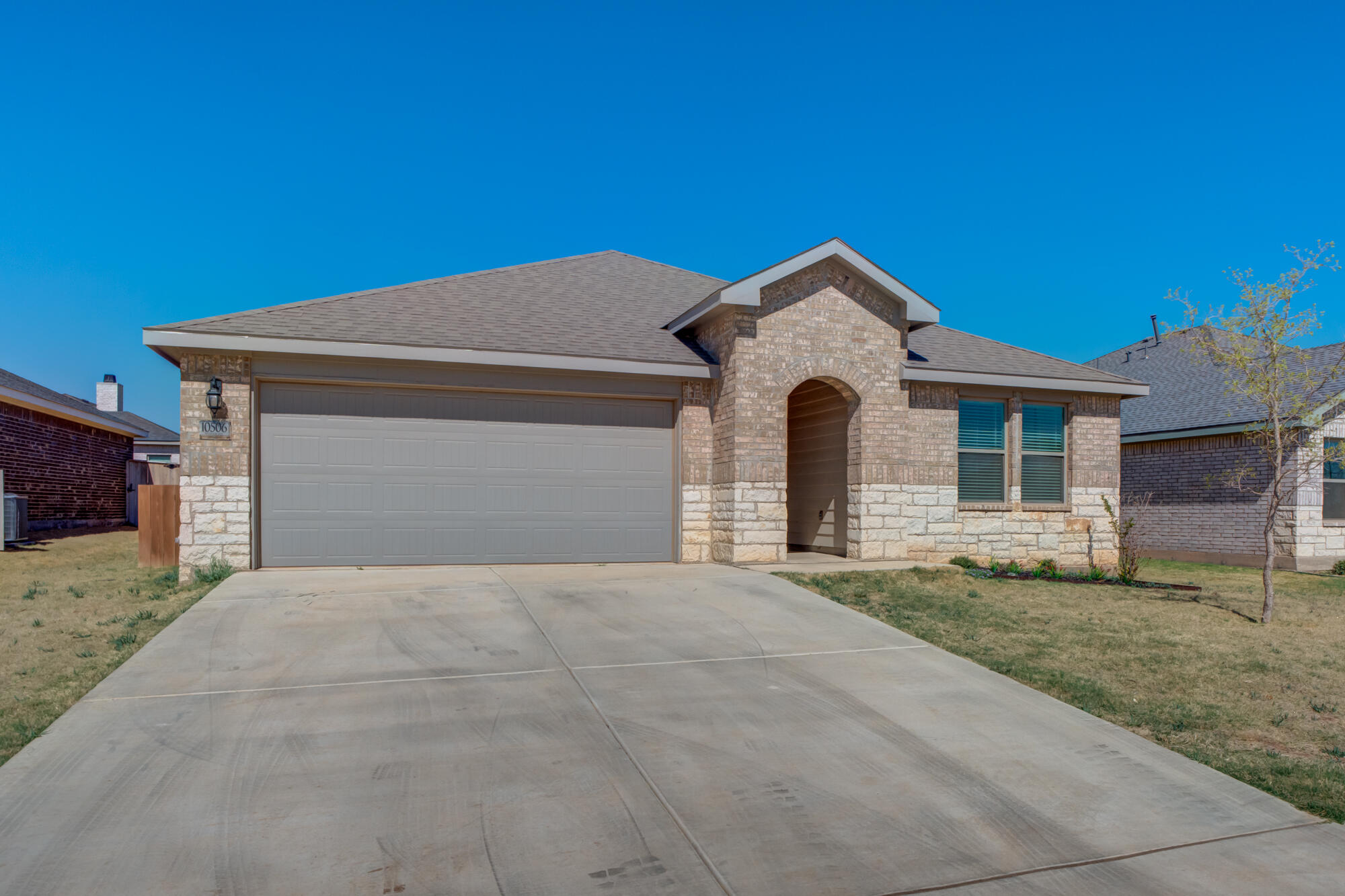 10506 Bangor Avenue Lubbock, TX 79424 - Photo 2 of 37 a front view of a house with a yard