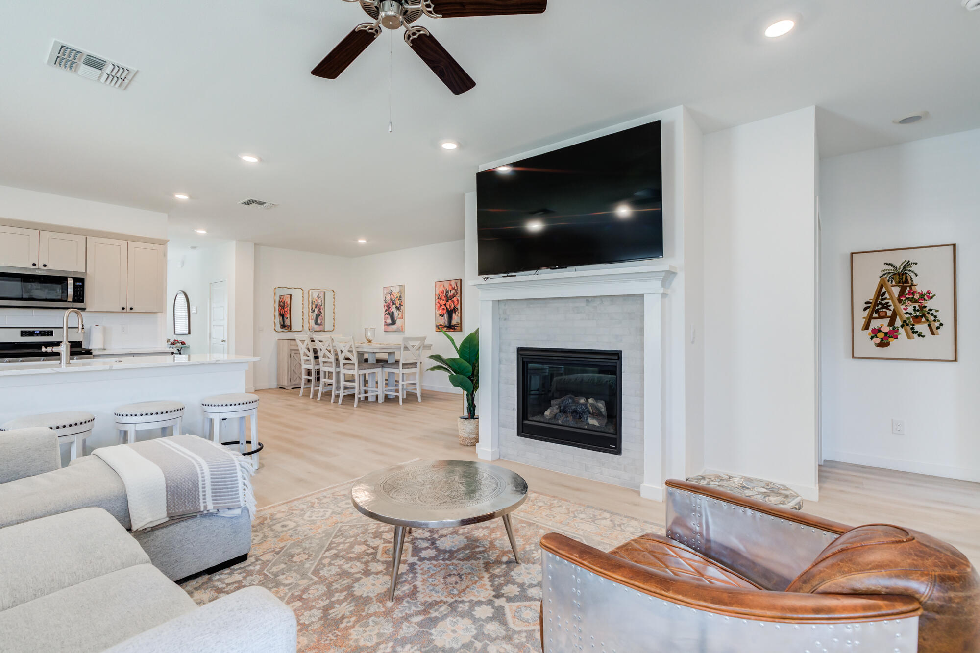 10506 Bangor Avenue Lubbock, TX 79424 - Photo 22 of 37 a living room with furniture and a flat screen tv