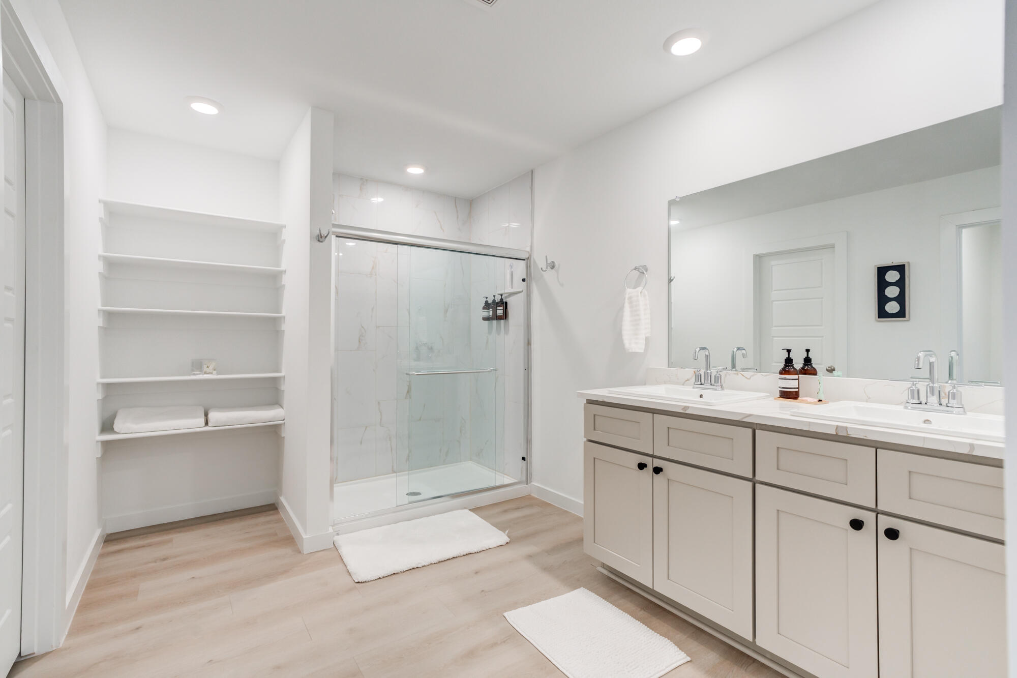 10506 Bangor Avenue Lubbock, TX 79424 - Photo 27 of 37 a bathroom with a double vanity sink mirror and shower