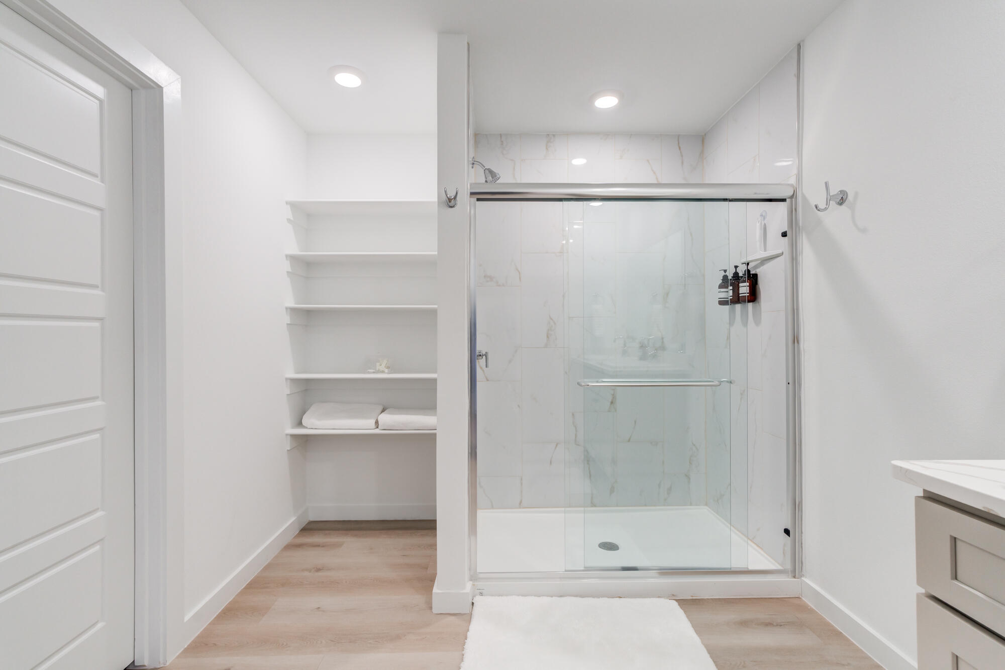 10506 Bangor Avenue Lubbock, TX 79424 - Photo 28 of 37 a bathroom with a glass shower door