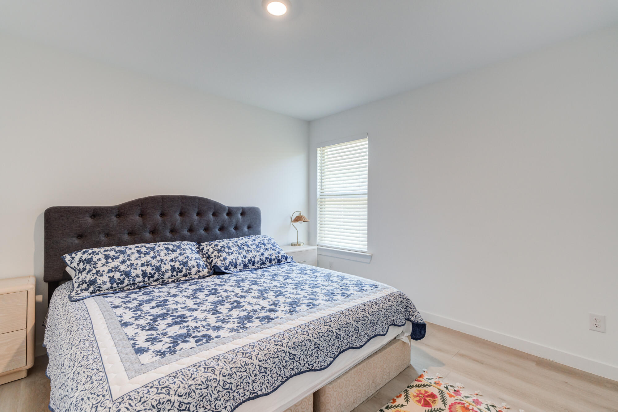 10506 Bangor Avenue Lubbock, TX 79424 - Photo 30 of 37 a bedroom with a large bed and a window