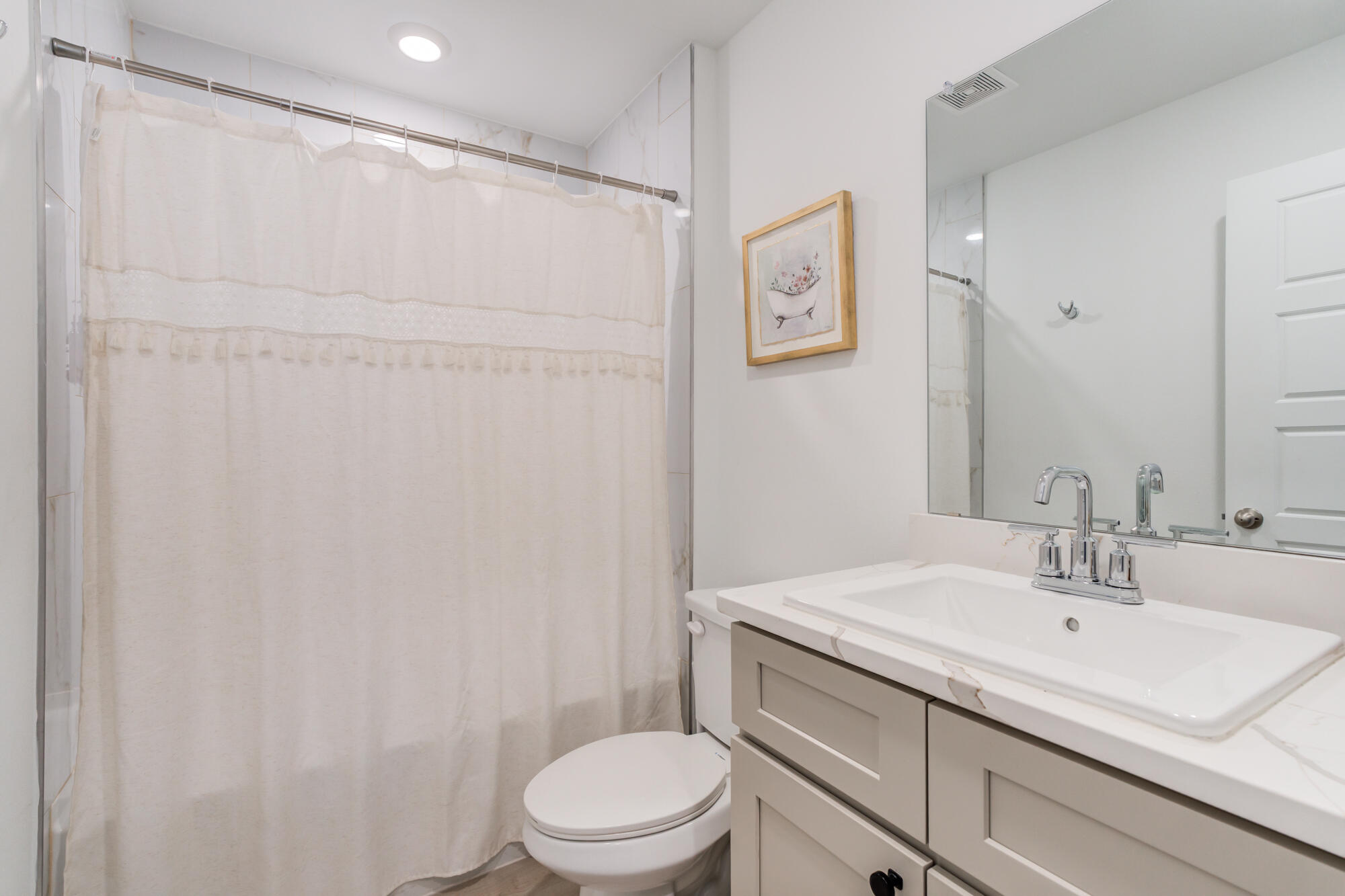 10506 Bangor Avenue Lubbock, TX 79424 - Photo 31 of 37 a bathroom with a sink toilet and vanity
