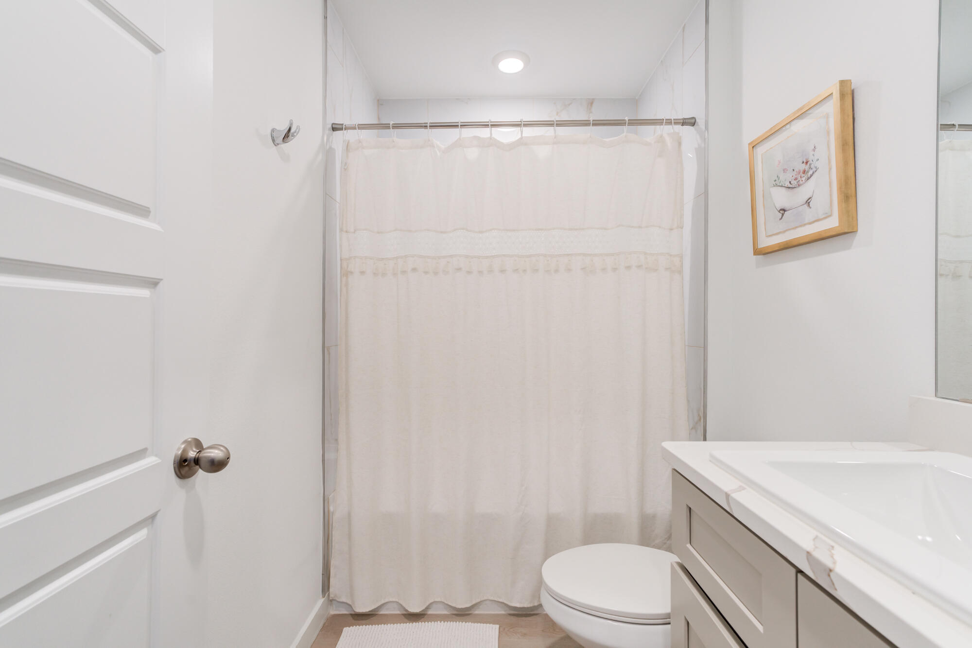 10506 Bangor Avenue Lubbock, TX 79424 - Photo 32 of 37 a bathroom with a shower a toilet and sink