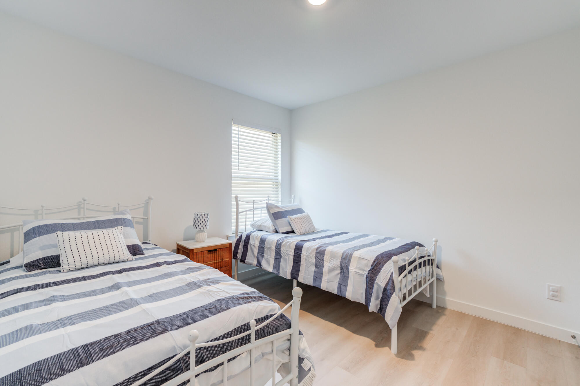 10506 Bangor Avenue Lubbock, TX 79424 - Photo 33 of 37 a bedroom with two beds and a window