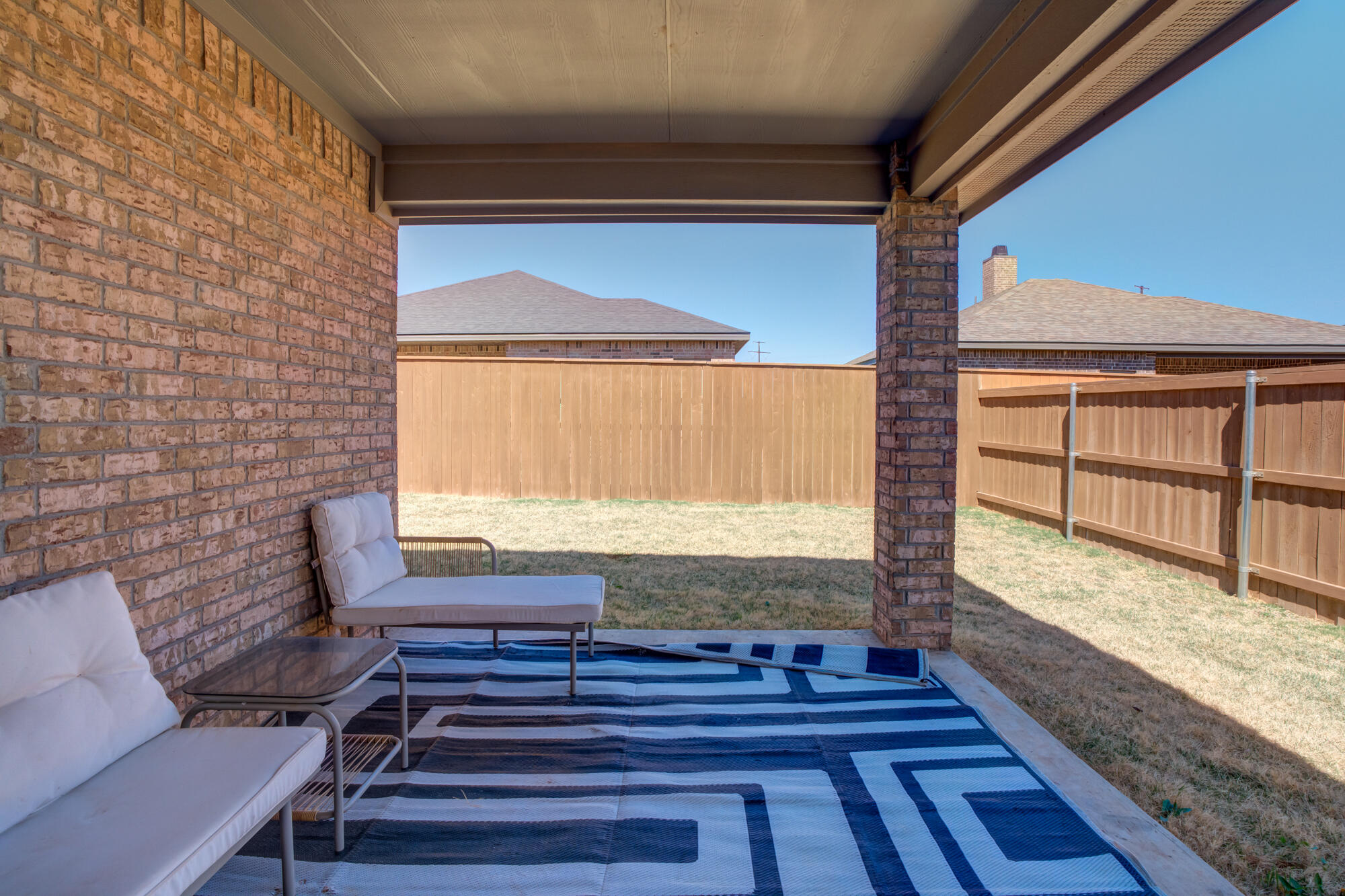 10506 Bangor Avenue Lubbock, TX 79424 - Photo 35 of 37 a view of a balcony with chair and wooden floor