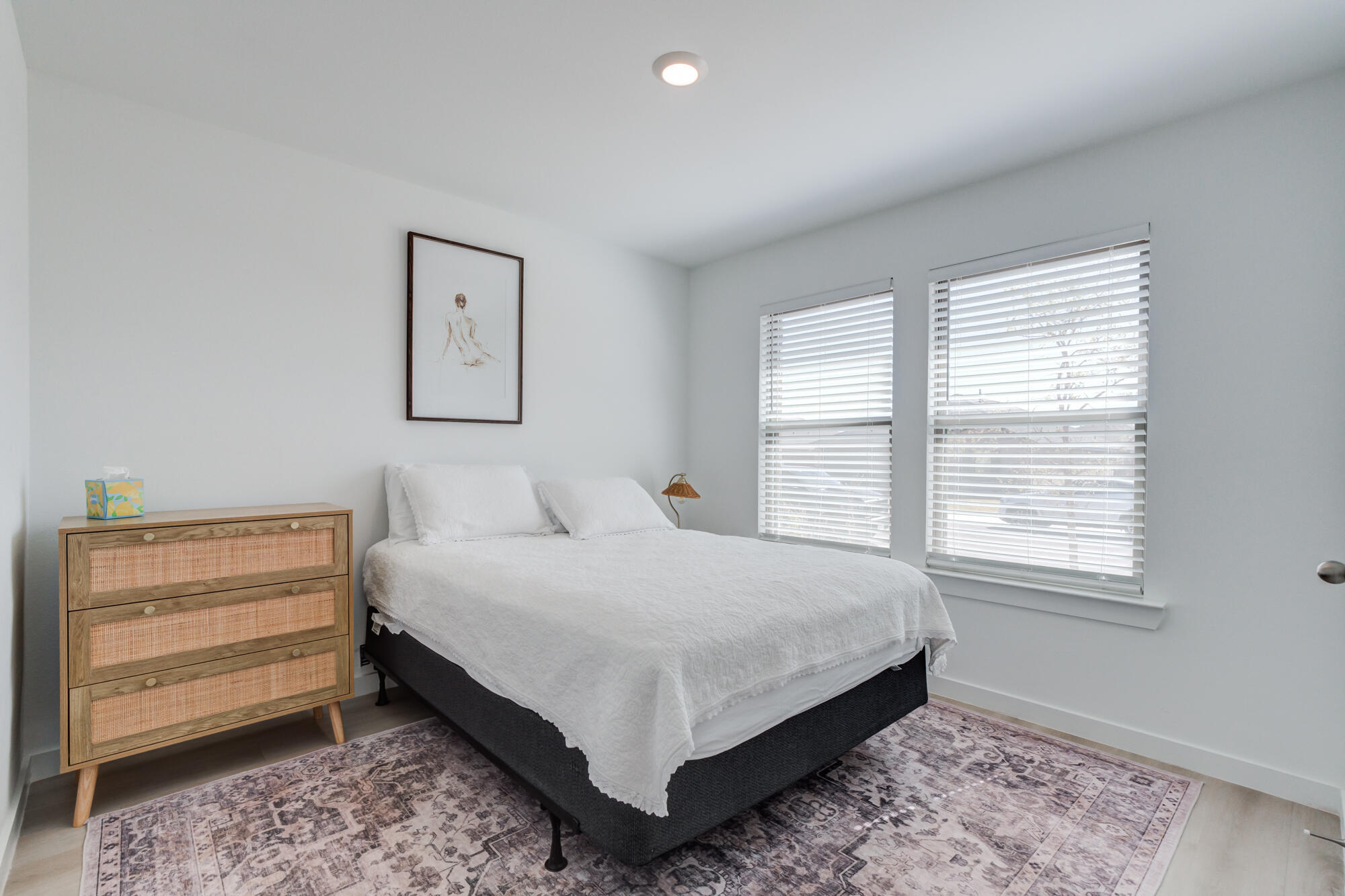 10506 Bangor Avenue Lubbock, TX 79424 - Photo 6 of 37 a large bed sitting in a bedroom next to a window