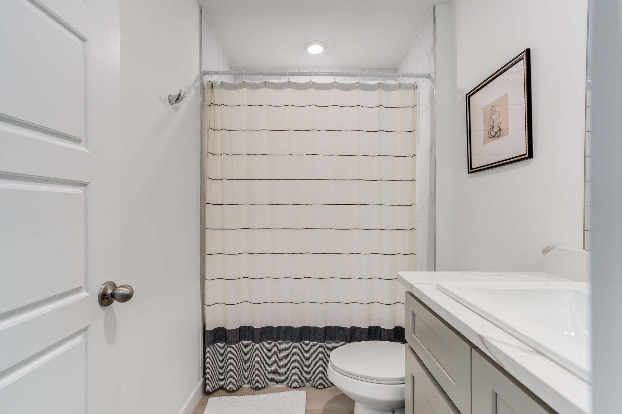 10506 Bangor Avenue Lubbock, TX 79424 - Photo 8 of 37 a bathroom with a toilet and a shower