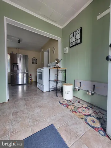 a view of a room with chandelier chandelier and windows