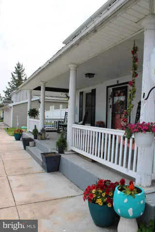 a view of a porch with furniture