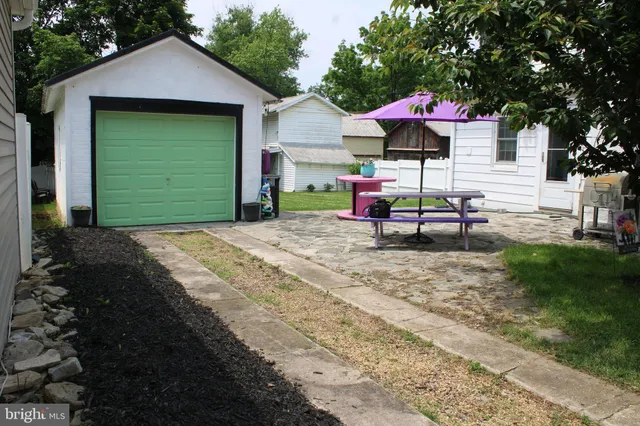a view of garage and yard