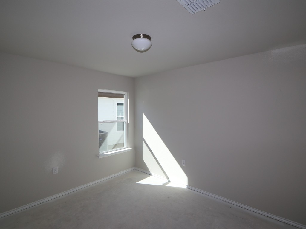 9204 Furman Drive Austin, TX 78747 - Photo 11 of 17 a view of a hallway with windows
