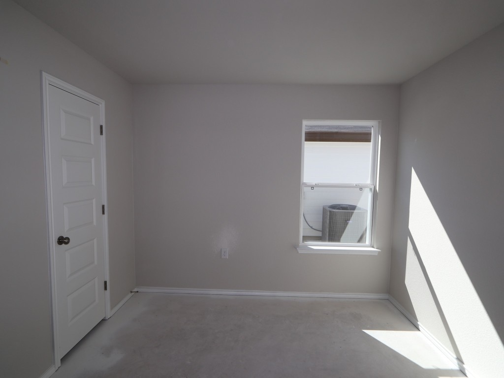 9204 Furman Drive Austin, TX 78747 - Photo 12 of 17 an empty room with windows and closet