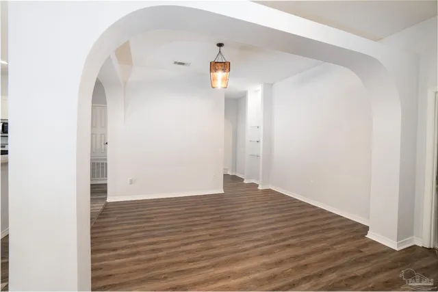 a view of a small space with wooden floor