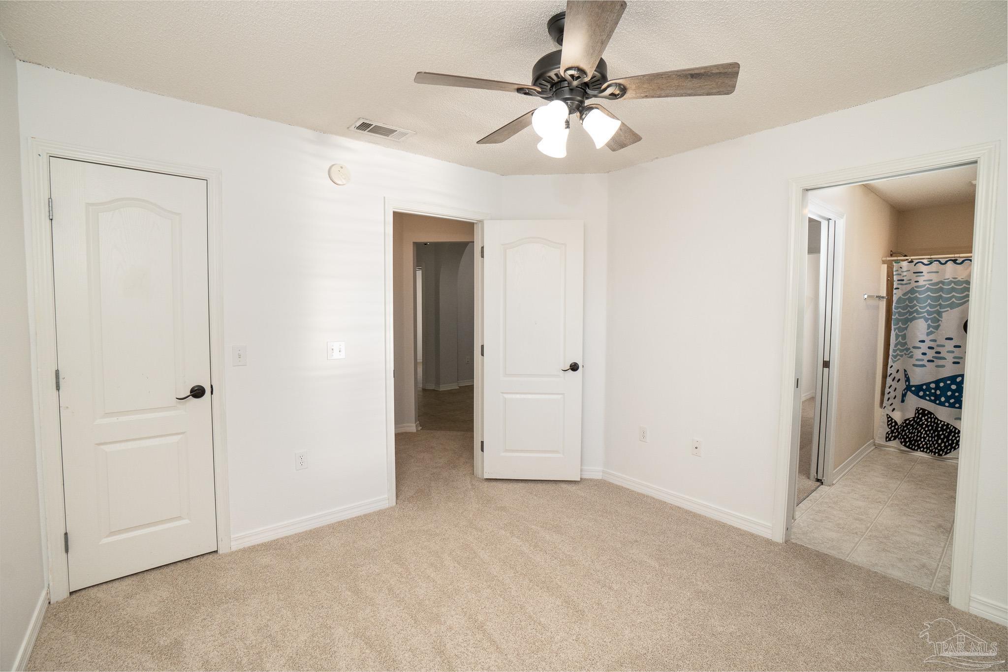 4836 Timber Ridge Drive Pace, FL 32571 - Photo 29 of 46 a view of a chandelier fan and closet area